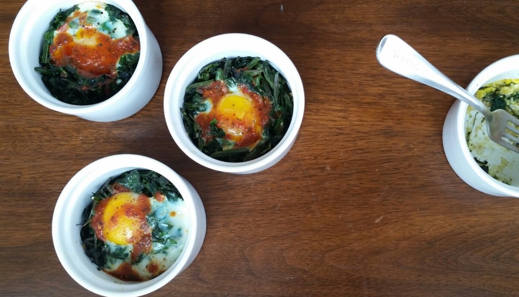 Baked Eggs with Lambsquarters and Harissa